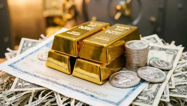 gold bars and silver coins resting
