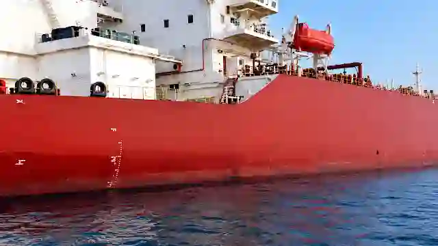 Heavy crude oil tanker hull docked as regional pipeline bypass routes like East-West pipeline take priority
