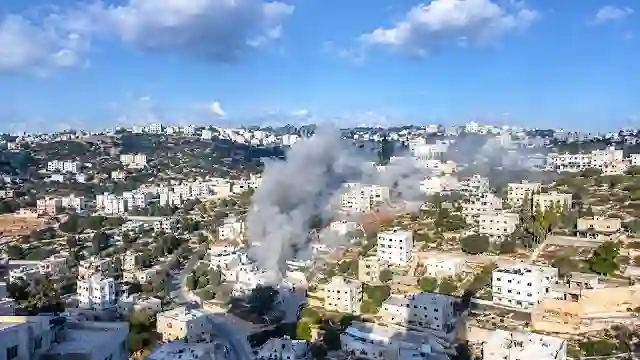 Plume of smoke rising from town houses