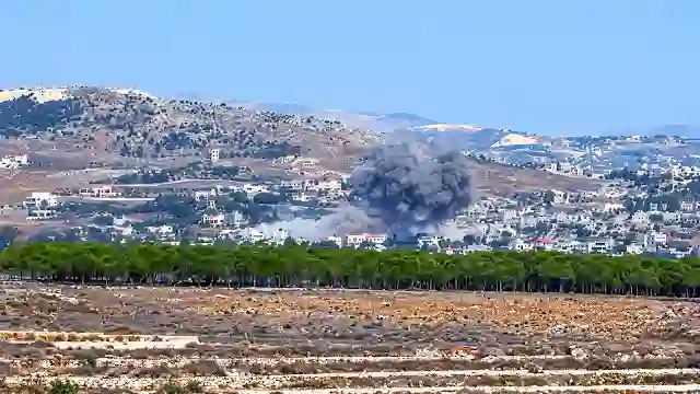 Grey smoke billowing from settlement in Yemen following intense airstrike campaign