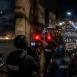Escalating Middle East crisis showing airport runway alerts, press safety risks, and street protests.