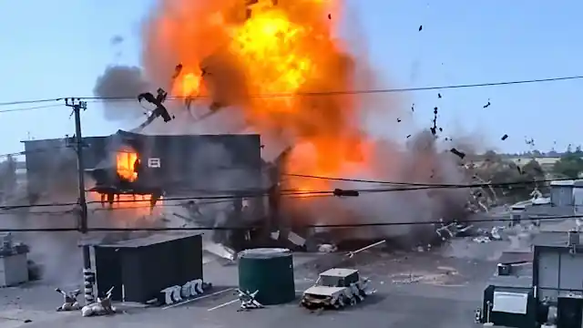 Massive fireball and smoke rising from a destroyed supermarket following a Russian drone strike in Ukraine